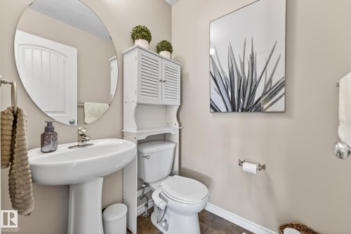 Bathroom with toilet and baseboards - 1734 63A Street, Edmonton, AB - Indoor Photo Showing Bathroom