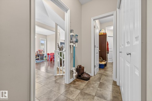 Hallway featuring light tile patterned floors - 1734 63A Street, Edmonton, AB - Indoor Photo Showing Other Room