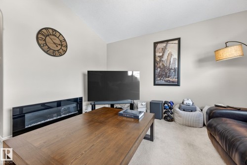 Office featuring carpet flooring and vaulted ceiling - 1734 63A Street, Edmonton, AB - Indoor With Fireplace