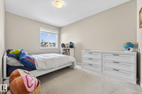 Carpeted bedroom with baseboards - 1734 63A Street, Edmonton, AB - Indoor Photo Showing Bedroom