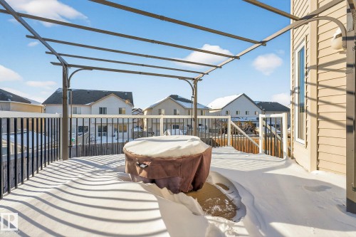 View of patio / terrace with a residential view, a wooden deck, and a jacuzzi - 1734 63A Street, Edmonton, AB - Outdoor With Deck Patio Veranda