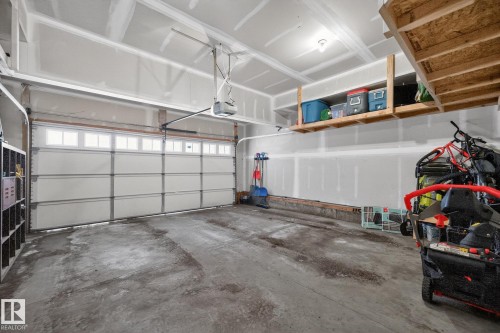 Garage featuring a garage door opener - 1734 63A Street, Edmonton, AB - Indoor Photo Showing Garage