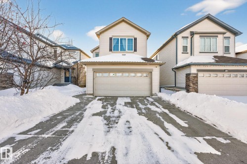 Traditional-style house featuring a garage and driveway - 1734 63A Street, Edmonton, AB - Outdoor With Facade