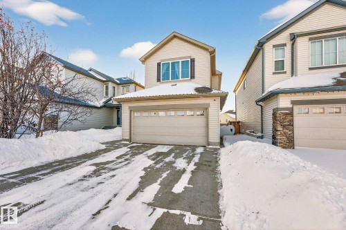 Traditional-style home with driveway and an attached garage - 1734 63A Street, Edmonton, AB - Outdoor With Facade