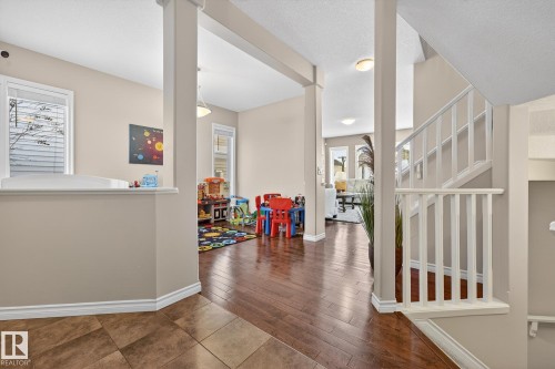 Hall featuring hardwood / wood-style flooring and a textured ceiling - 1734 63A Street, Edmonton, AB - Indoor Photo Showing Other Room