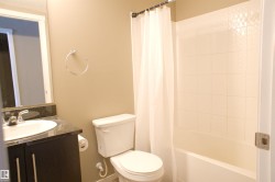 Bathroom featuring vanity and shower / tub combo with curtain - 