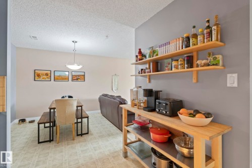 Dining area with light flooring and a textured ceiling - 1925 Saddleback Road, Edmonton, AB - Indoor