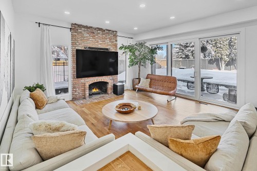 100 Wolf Willow Crescent, Edmonton, AB - Indoor Photo Showing Living Room With Fireplace