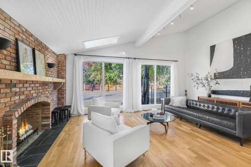 100 Wolf Willow Crescent, Edmonton, AB - Indoor Photo Showing Living Room With Fireplace