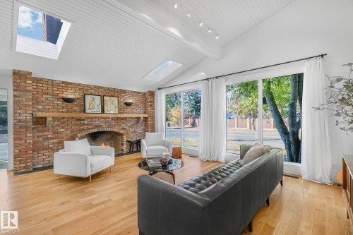 100 Wolf Willow Crescent, Edmonton, AB - Indoor Photo Showing Living Room With Fireplace