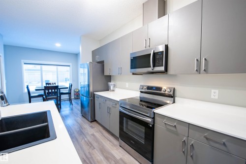 1527 16 Avenue, Edmonton, AB - Indoor Photo Showing Kitchen With Stainless Steel Kitchen With Double Sink