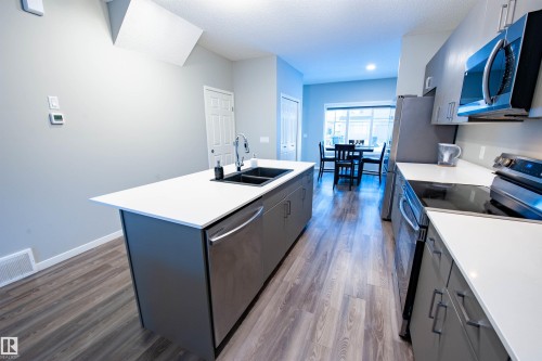 1527 16 Avenue, Edmonton, AB - Indoor Photo Showing Kitchen With Double Sink