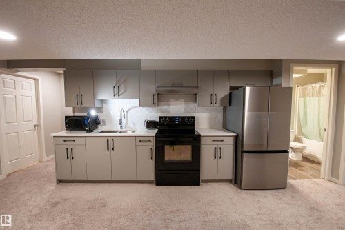 1527 16 Avenue, Edmonton, AB - Indoor Photo Showing Kitchen With Double Sink