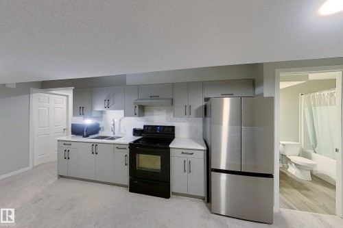 1527 16 Avenue, Edmonton, AB - Indoor Photo Showing Kitchen With Double Sink