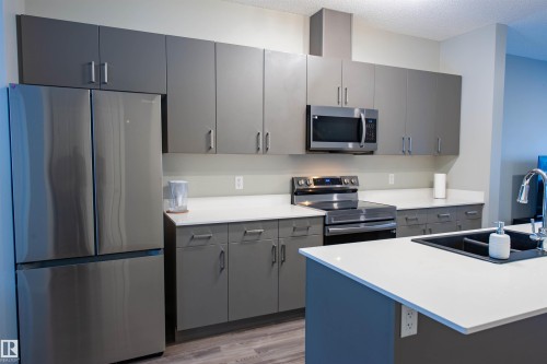 1527 16 Avenue, Edmonton, AB - Indoor Photo Showing Kitchen With Stainless Steel Kitchen With Double Sink