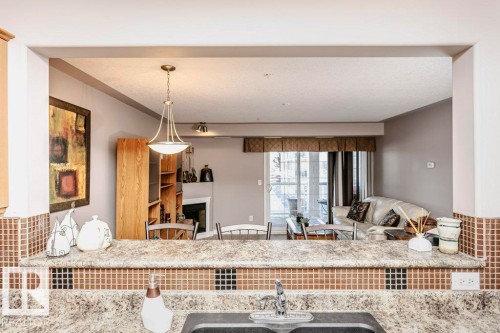 325 7801 Golf Course Road, Stony Plain, AB - Indoor Photo Showing Kitchen With Upgraded Kitchen