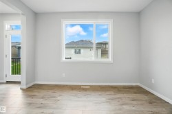 Empty room featuring light wood-style floors and baseboards - 