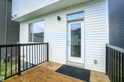 View of exterior entry with a wooden deck - 