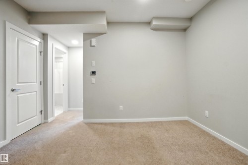 Unfurnished room with light carpet and recessed lighting - 20727 25 Ave, Edmonton, AB - Indoor Photo Showing Other Room