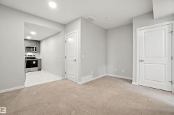 Unfurnished living room featuring light carpet and recessed lighting - 