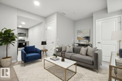 Living area with recessed lighting and light colored carpet - 
