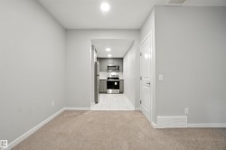 Hall featuring light carpet and recessed lighting - 