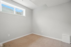 Unfurnished room featuring baseboards and carpet floors - 