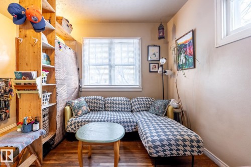 Sitting room featuring plenty of natural light and dark wood-style floors - 11240 84 Street, Edmonton, AB - Indoor