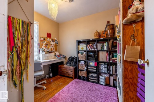 Office featuring wood finished floors - 11240 84 Street, Edmonton, AB - Indoor Photo Showing Office