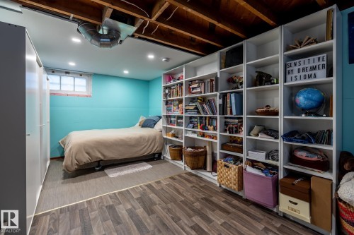 Bedroom with dark wood-type flooring and recessed lighting - 11240 84 Street, Edmonton, AB - Indoor