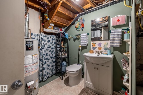 Bathroom featuring vanity and water heater - 11240 84 Street, Edmonton, AB - Indoor Photo Showing Basement