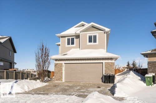 View of front of home with stone siding and a garage - 62 Ellice Bend, Fort Saskatchewan, AB - Outdoor