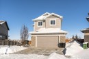 View of front of home with stone siding and a garage - 62 Ellice Bend, Fort Saskatchewan, AB  - Outdoor 