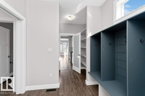 Mudroom featuring dark wood-style floors and a textured ceiling - 62 Ellice Bend, Fort Saskatchewan, AB -  Photo Showing Other Room