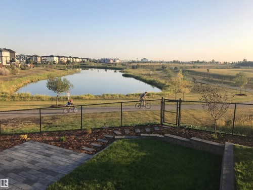 View of yard with a gate and a water view - 62 Ellice Bend, Fort Saskatchewan, AB - Outdoor With View