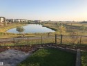 View of yard with a gate and a water view - 62 Ellice Bend, Fort Saskatchewan, AB  - Outdoor With View 