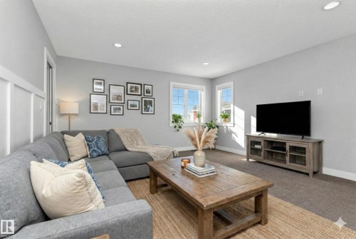 Living area with carpet and recessed lighting - 62 Ellice Bend, Fort Saskatchewan, AB - Indoor Photo Showing Living Room