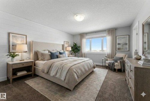 Bedroom with a textured ceiling and dark carpet - 62 Ellice Bend, Fort Saskatchewan, AB - Indoor Photo Showing Bedroom