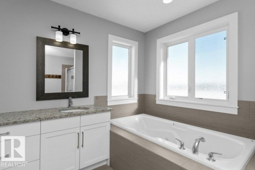 Full bath with vanity, a bath, and a shower - 62 Ellice Bend, Fort Saskatchewan, AB - Indoor Photo Showing Bathroom