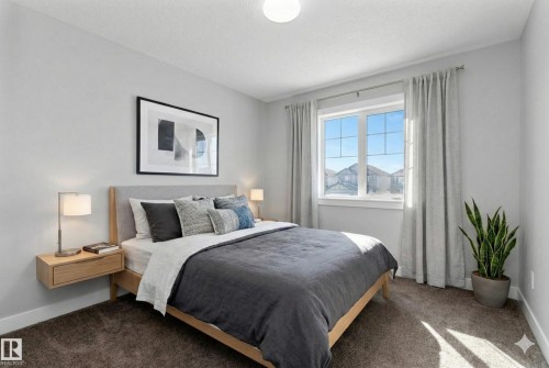 Carpeted bedroom with baseboards - 62 Ellice Bend, Fort Saskatchewan, AB - Indoor Photo Showing Bedroom