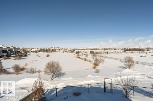 Snowy yard featuring a gate - 62 Ellice Bend, Fort Saskatchewan, AB - Outdoor With View