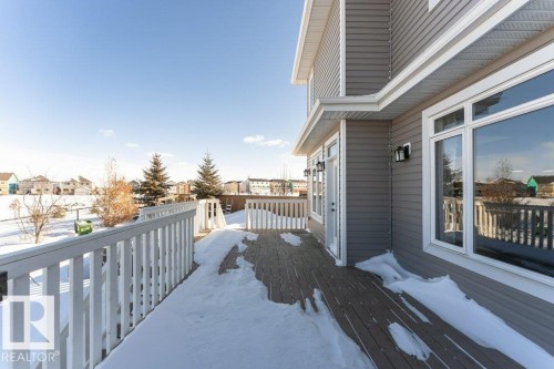 View of wooden balcony featuring a wooden deck and a residential view - 62 Ellice Bend, Fort Saskatchewan, AB - Outdoor With Exterior