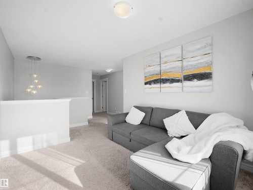 Living area with carpet and baseboards - 218 Hawks Ridge Boulevard, Edmonton, AB - Indoor Photo Showing Living Room