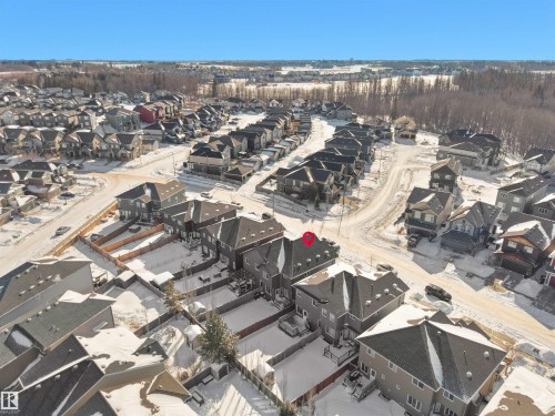 Aerial view of property and surrounding area with nearby suburban area - 218 Hawks Ridge Boulevard, Edmonton, AB - Outdoor With View