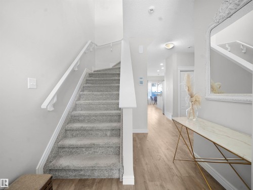 Staircase with wood finished floors and recessed lighting - 218 Hawks Ridge Boulevard, Edmonton, AB - Indoor Photo Showing Other Room