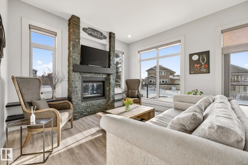 4001 Triomphe Boulevard, Beaumont, AB - Indoor Photo Showing Living Room With Fireplace