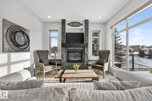 4001 Triomphe Boulevard, Beaumont, AB - Indoor Photo Showing Living Room With Fireplace