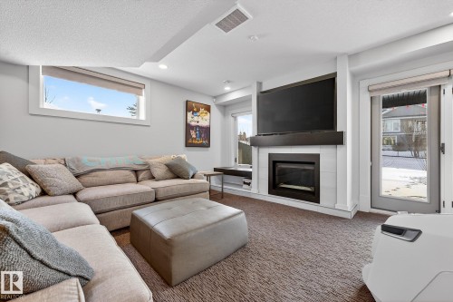 4001 Triomphe Boulevard, Beaumont, AB - Indoor Photo Showing Living Room With Fireplace