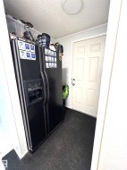 Side entrance with plenty of space for a fridge or stand up deep freeze. - 