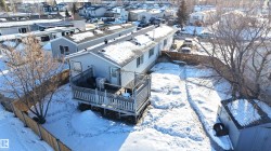 Snowy aerial view featuring a residential view - 